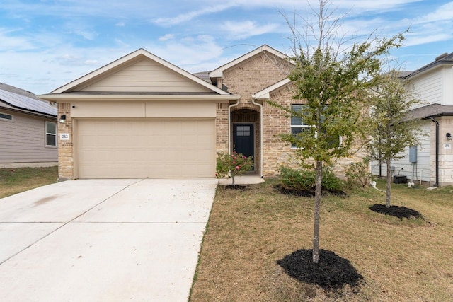 view of front of home featuring a garage and a front lawn