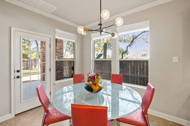 dining room featuring tile patterned floors, an inviting chandelier, and ornamental molding