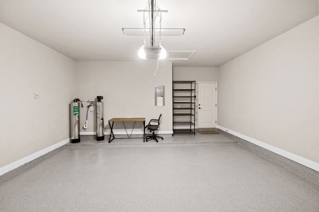 garage featuring a garage door opener and electric panel