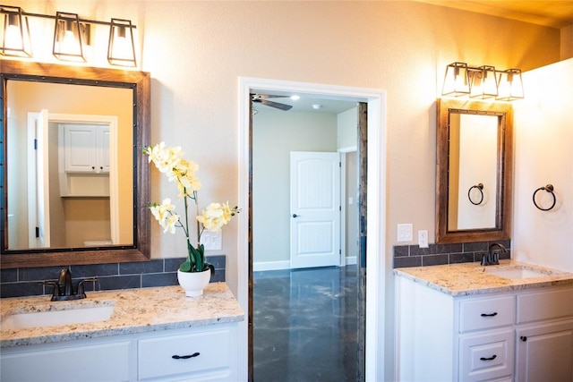 bathroom featuring decorative backsplash, vanity, and ceiling fan