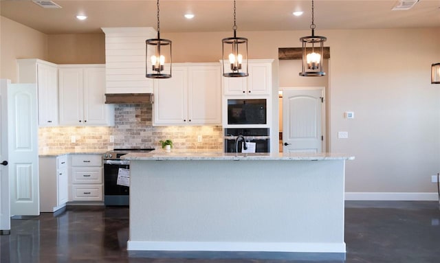 kitchen featuring white cabinets, oven, a center island with sink, and electric stove