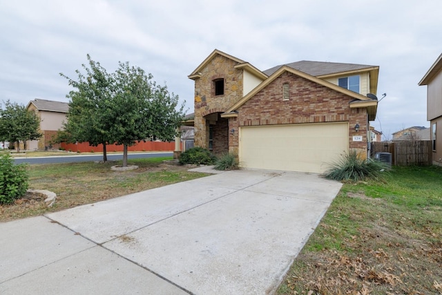 view of front of property with cooling unit and a garage