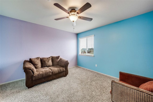 sitting room with ceiling fan and carpet floors