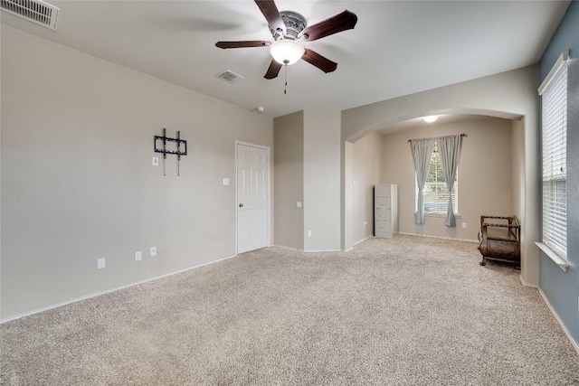 carpeted empty room with ceiling fan