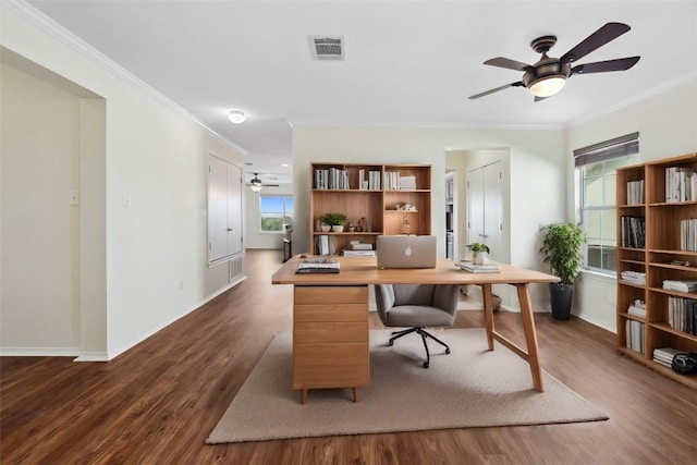 office space with dark hardwood / wood-style floors and crown molding