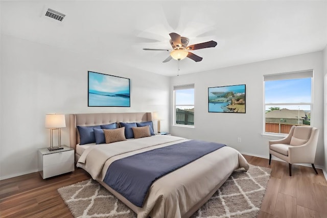 bedroom with hardwood / wood-style flooring and ceiling fan