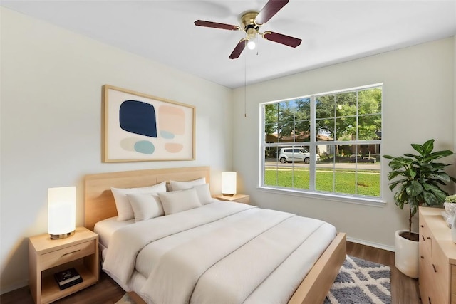 bedroom featuring hardwood / wood-style flooring and ceiling fan