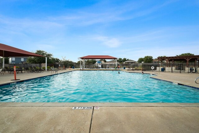 view of swimming pool featuring a patio