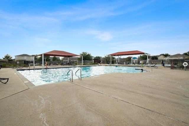 view of swimming pool with a patio