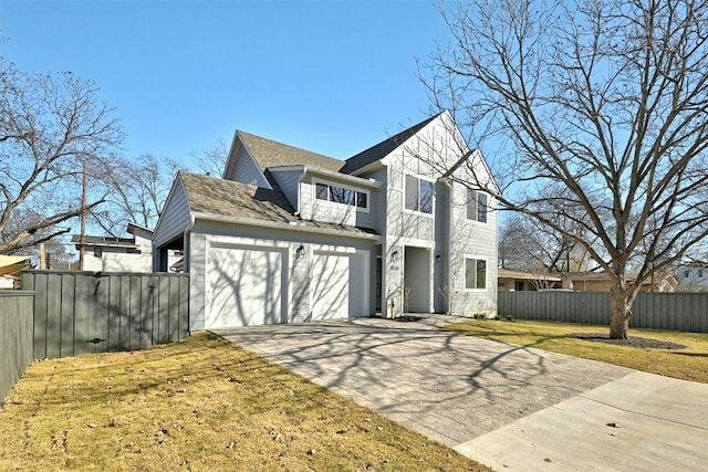 view of front of house with a garage and a front lawn