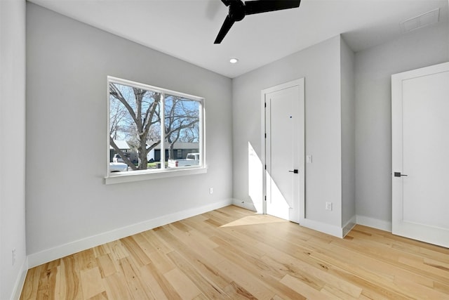 unfurnished bedroom with ceiling fan and light hardwood / wood-style flooring