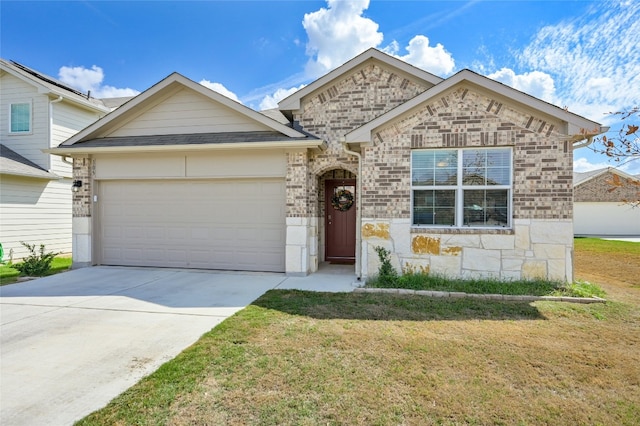 view of front of property with a front lawn and a garage