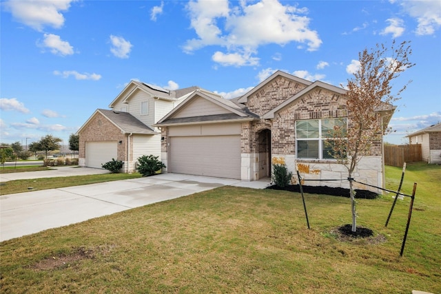 view of front of property featuring a front yard and a garage