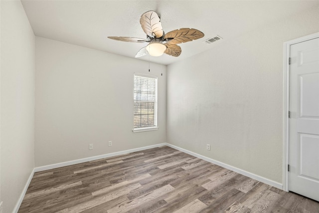 empty room featuring wood-type flooring and ceiling fan