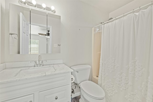 full bathroom featuring shower / bath combination with curtain, vanity, toilet, and ceiling fan