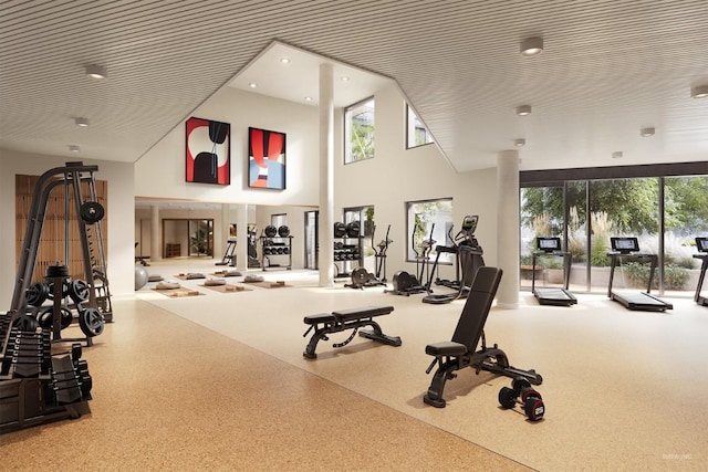 gym with a towering ceiling