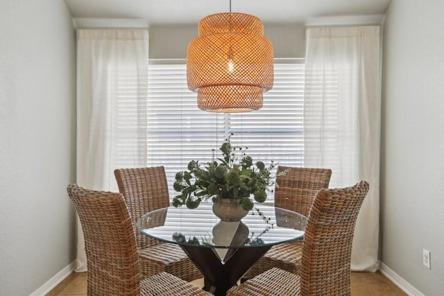 dining space with tile patterned flooring