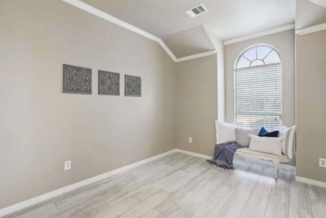 unfurnished room with crown molding and light wood-type flooring