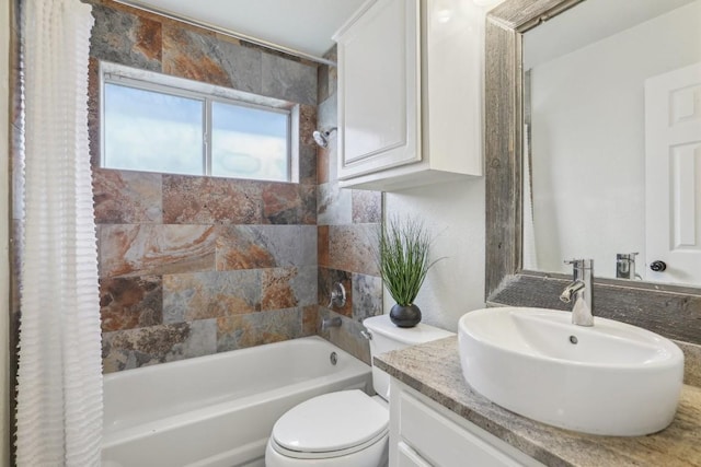 full bathroom featuring shower / bath combination with curtain, vanity, and toilet