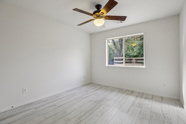 unfurnished room featuring ceiling fan and light hardwood / wood-style floors