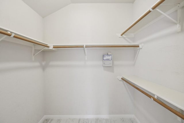 spacious closet featuring vaulted ceiling