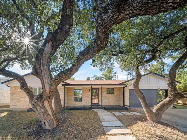 view of front of home featuring covered porch and a garage