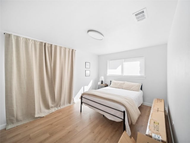 bedroom with light wood-type flooring