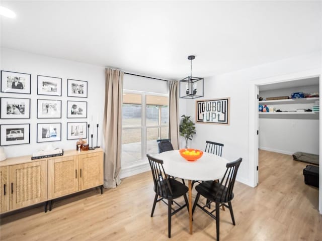 dining room featuring a chandelier and light hardwood / wood-style floors