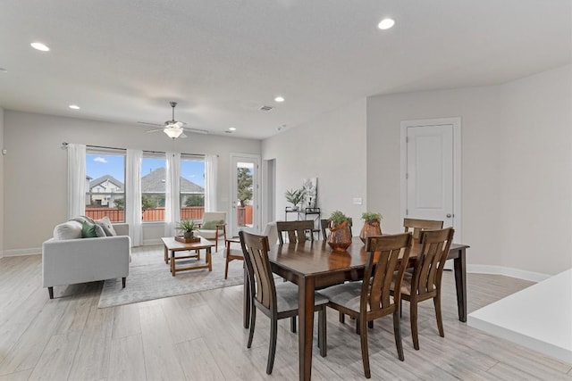 dining room featuring light hardwood / wood-style floors and ceiling fan