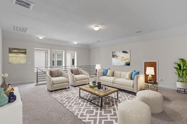 living room featuring light carpet and a textured ceiling