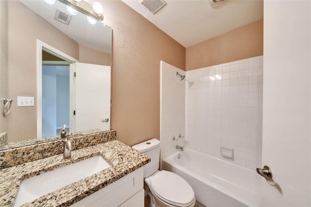 full bathroom with vanity, toilet, and tiled shower / bath