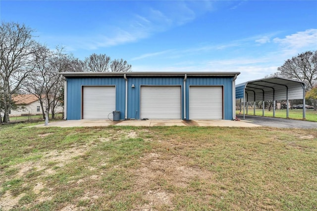 garage with a yard and a carport