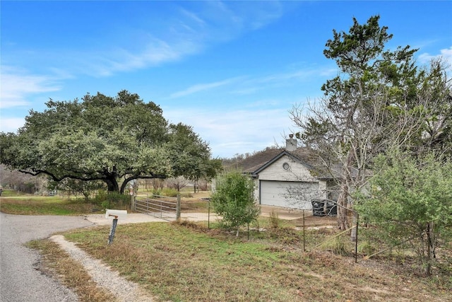 view of side of home with a garage