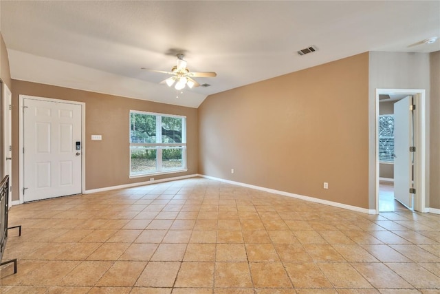 tiled spare room featuring ceiling fan and lofted ceiling