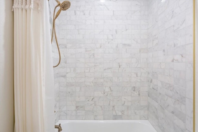 bathroom with shower / bathtub combination with curtain