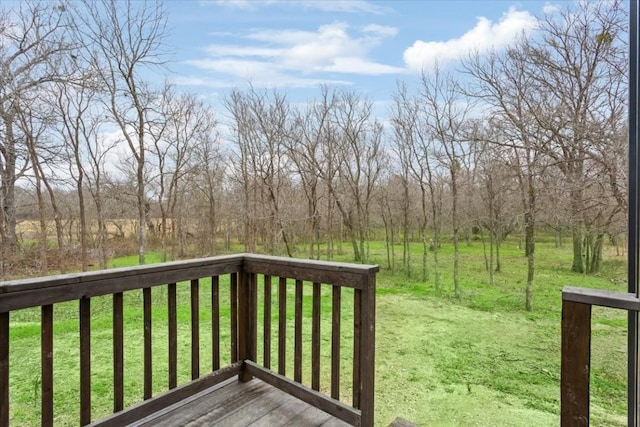 deck featuring a lawn