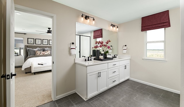 bathroom with ceiling fan and vanity