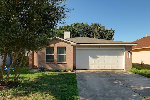 ranch-style home featuring a front lawn and a garage