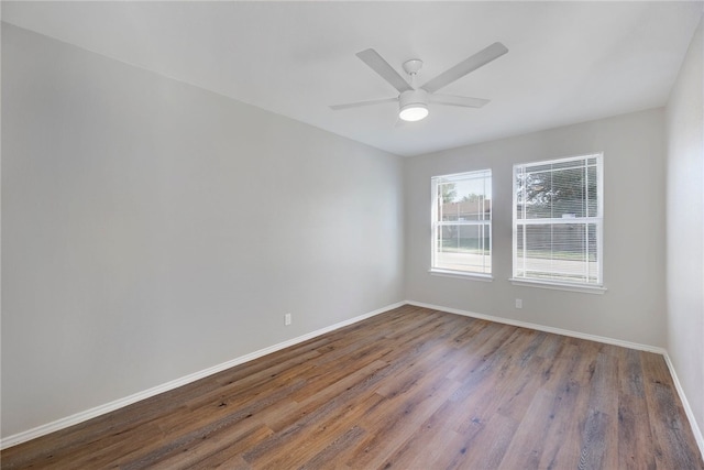 unfurnished room with ceiling fan and wood-type flooring