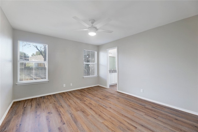 unfurnished room with ceiling fan and light hardwood / wood-style floors