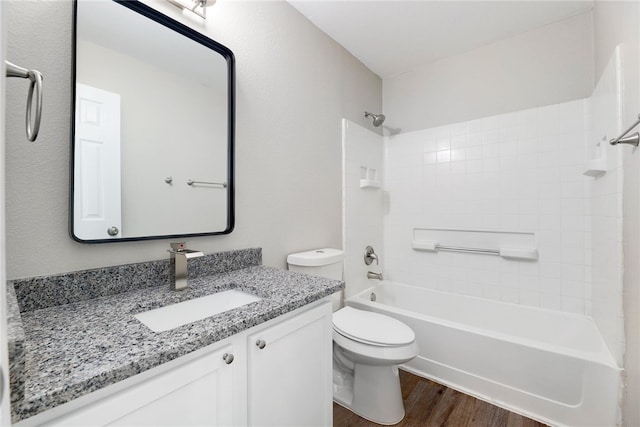 full bathroom with hardwood / wood-style flooring, vanity, toilet, and bathing tub / shower combination