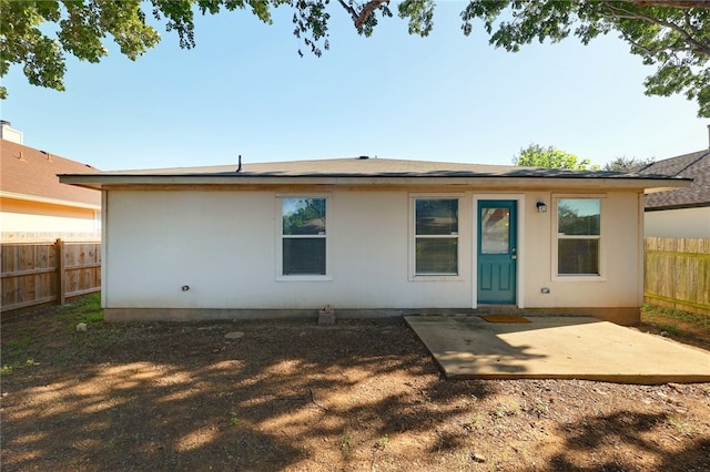 rear view of property featuring a patio