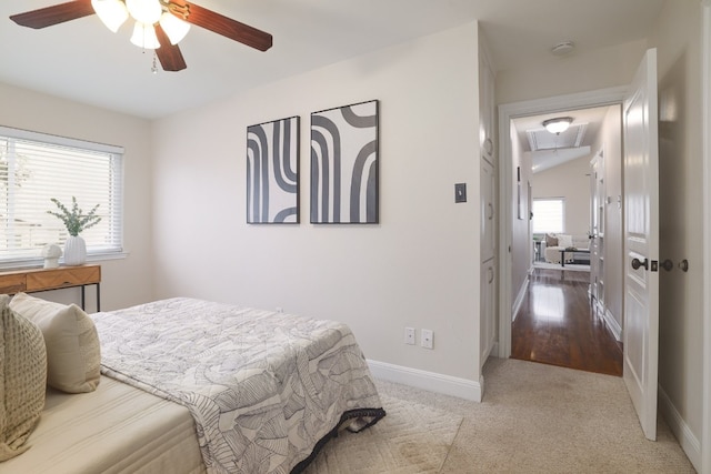 carpeted bedroom featuring ceiling fan