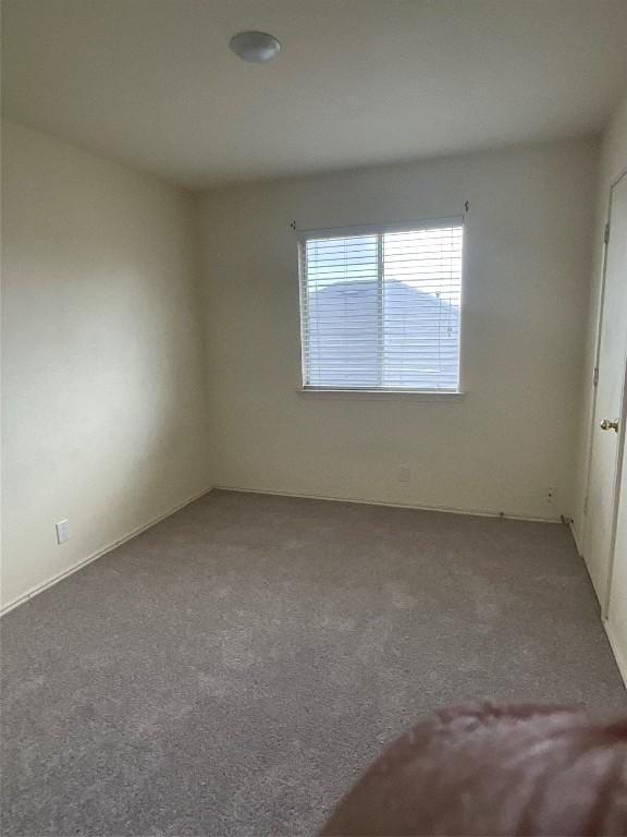 empty room featuring carpet flooring