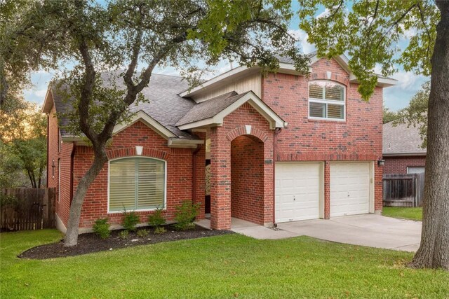 view of front of property featuring a garage and a front yard