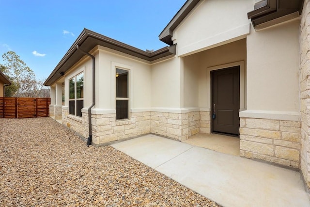 view of side of home with a patio area