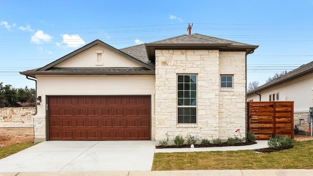 view of front of property with a garage