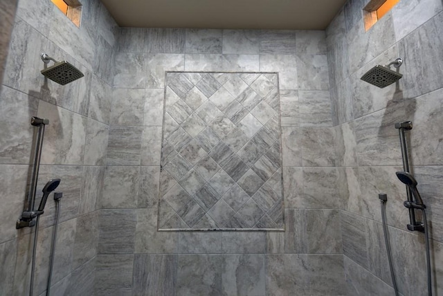 interior details featuring a tile shower