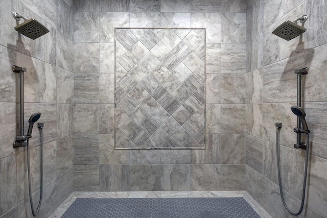 bathroom with a tile shower