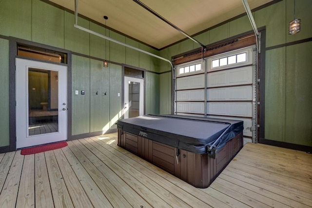 wooden deck with a covered hot tub